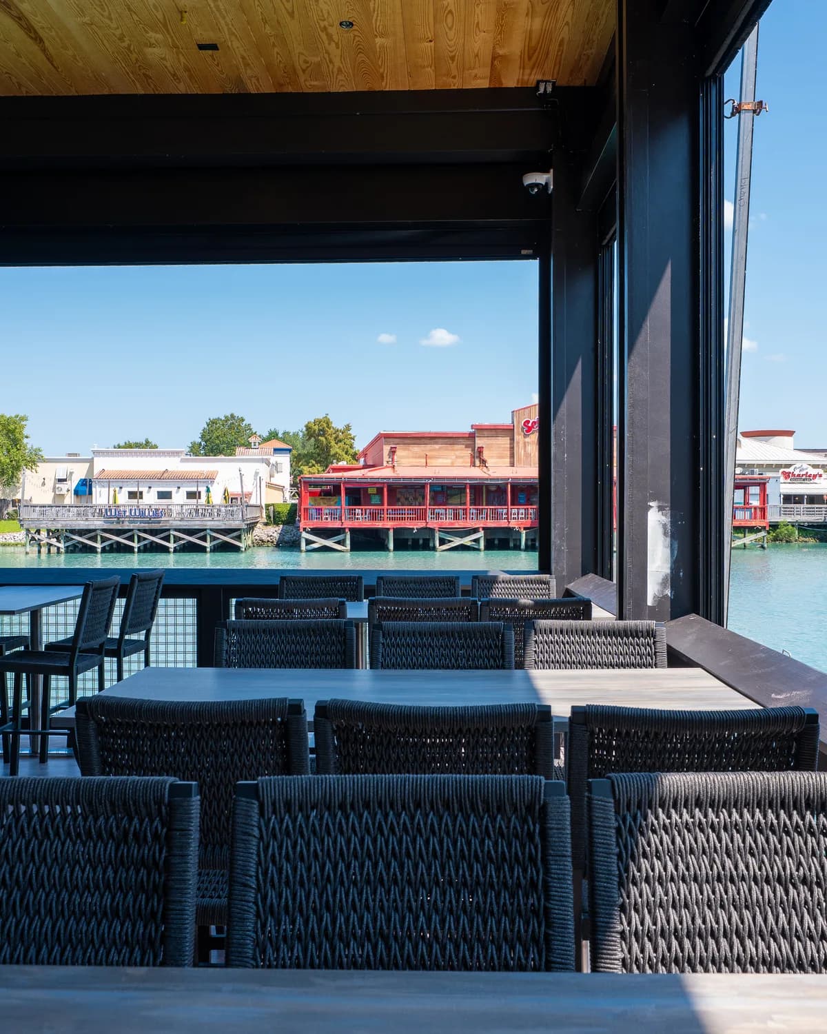 Covered seating at Big Fish overlooking the water in daylight